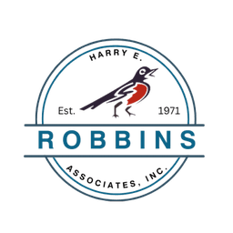 Harry E. Robbins Associates round badge, established 1971